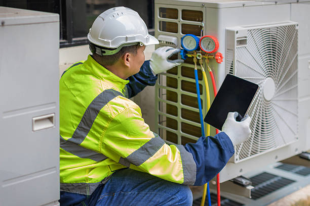 Professional Air Duct Cleaning technician working in Clearfield, UT